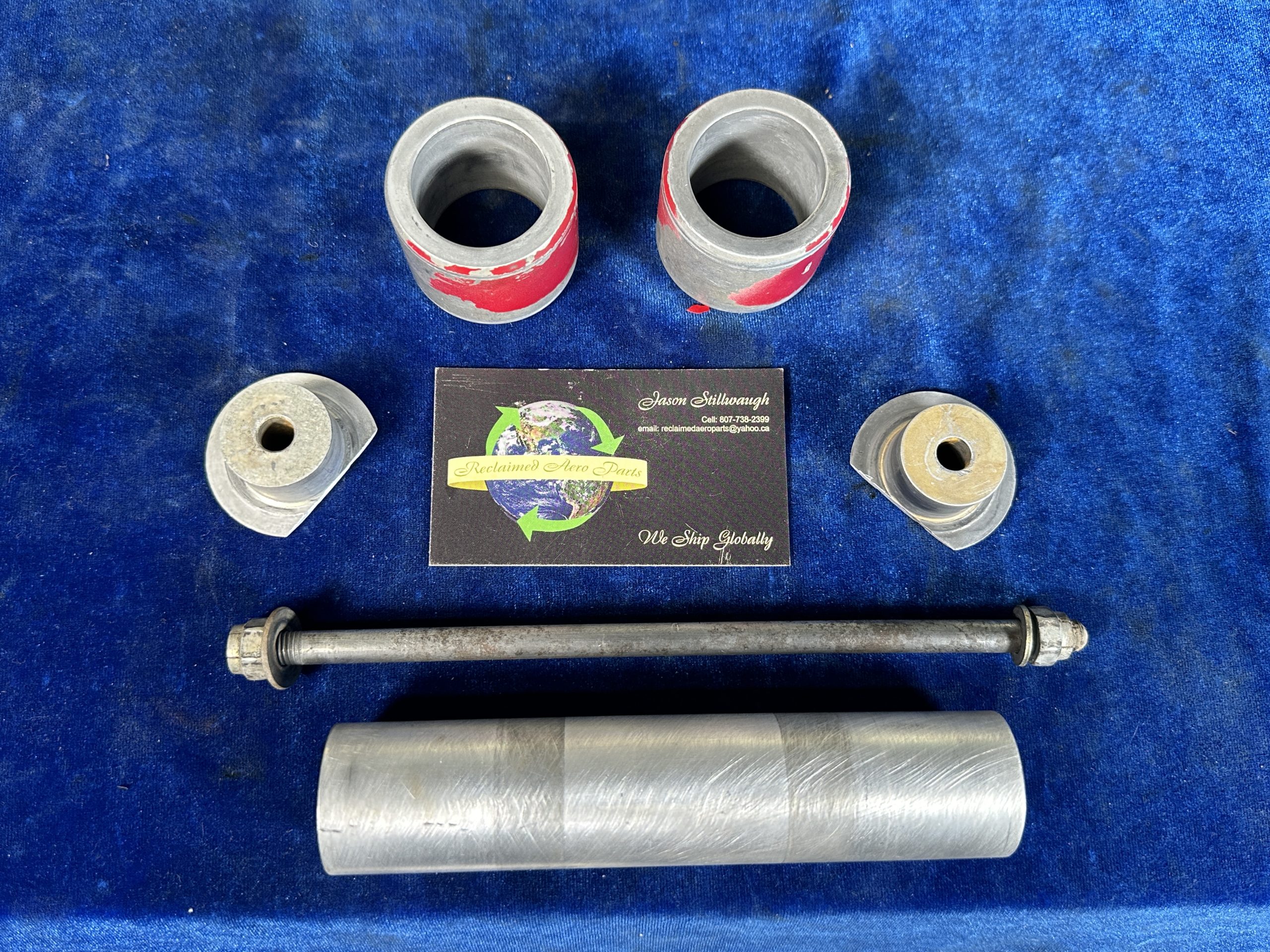 AXLE WITH SPACERS, PLUGS & AXLE ROD